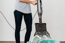 How do you remove the pad from a shark steam mop?